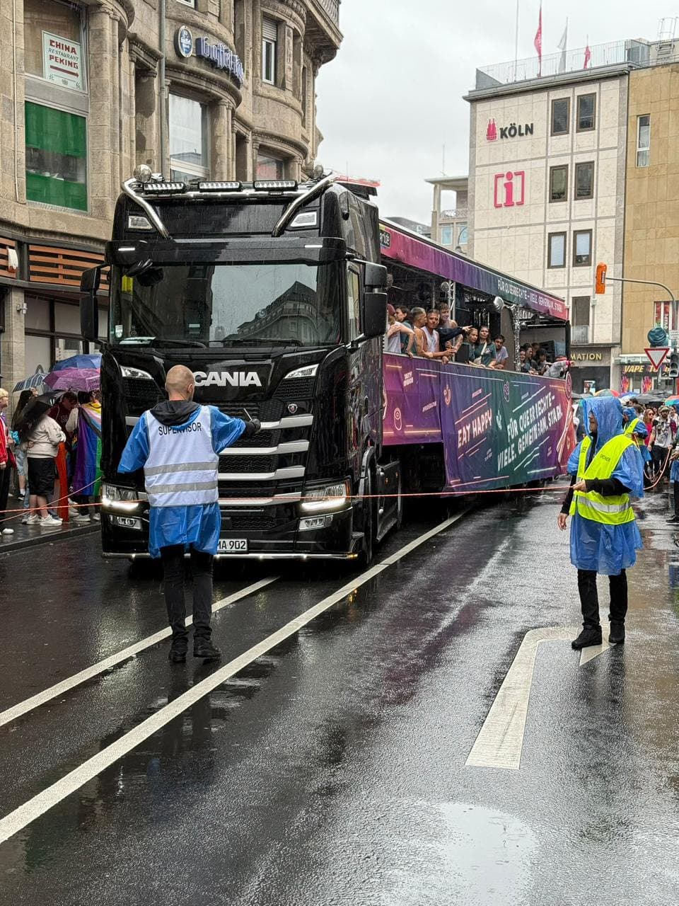 MOGROUP stewards escorting a parade float at CSD